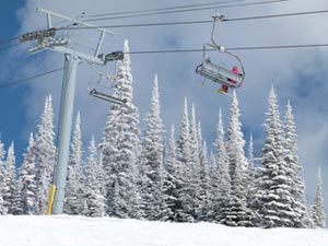 A skier could be facing charges after pushing a snowboarder off the chair lift.