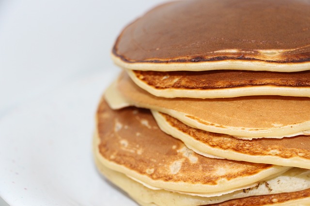 A man was charges with Obstructing a Road for bringing a table and chair into the middle of the road and sitting down to eat a pancake breakfast.