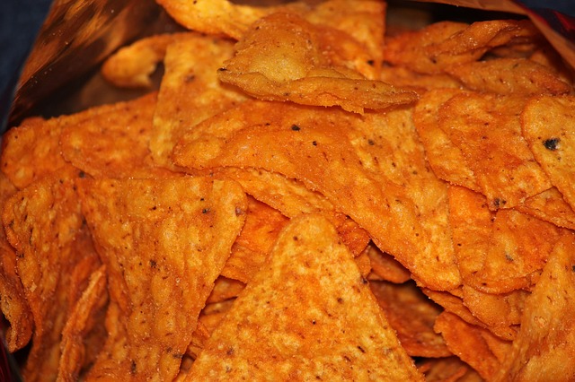 A grandmother was charged with Introducing Contraband in the First Degree after bringing in a bag of Doritos with drugs hidden inside to visit her grandson in prison.