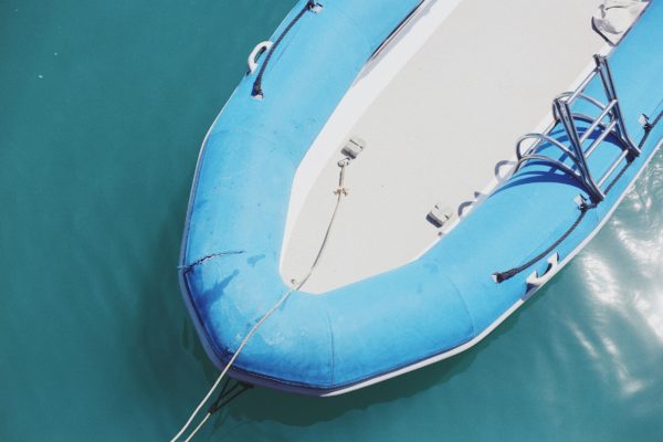 A mom was arrested for Child Abuse after she was caught driving her car with her kids on top to hold down an inflatable pool.